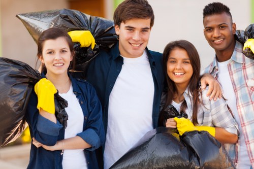 Professional home clearance team removing furniture in Leyton